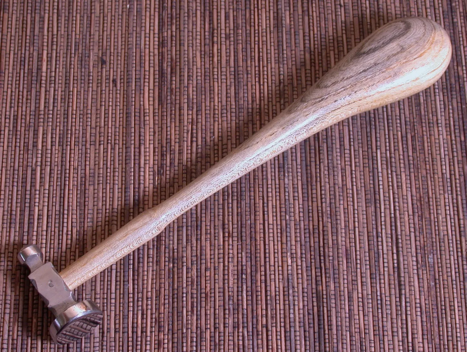 Polished steel flat, face size 1 1/8 inches, planishing chasing hammer, smoothing work, with ergo handle grip