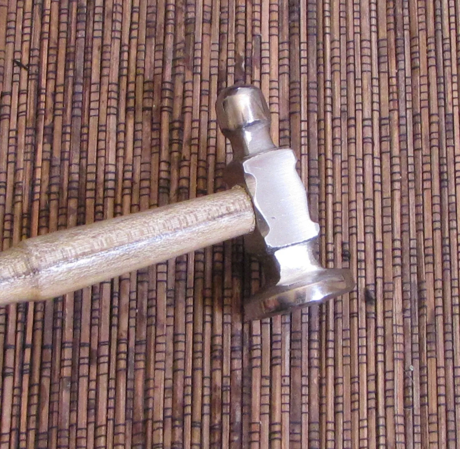 Polished steel flat, face size 1 1/8 inches, planishing chasing hammer, smoothing work, with ergo handle grip